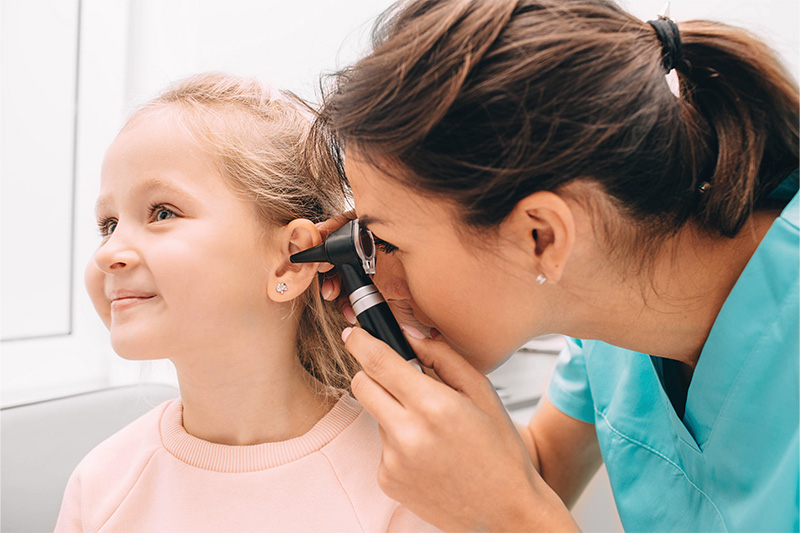 Doctor performing an ear exam