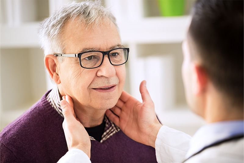 Dr. Goheen examining a sore throat